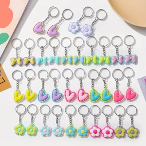 Llaveros Coloridos con Flores y Lazos en PVC Pack x12 uds